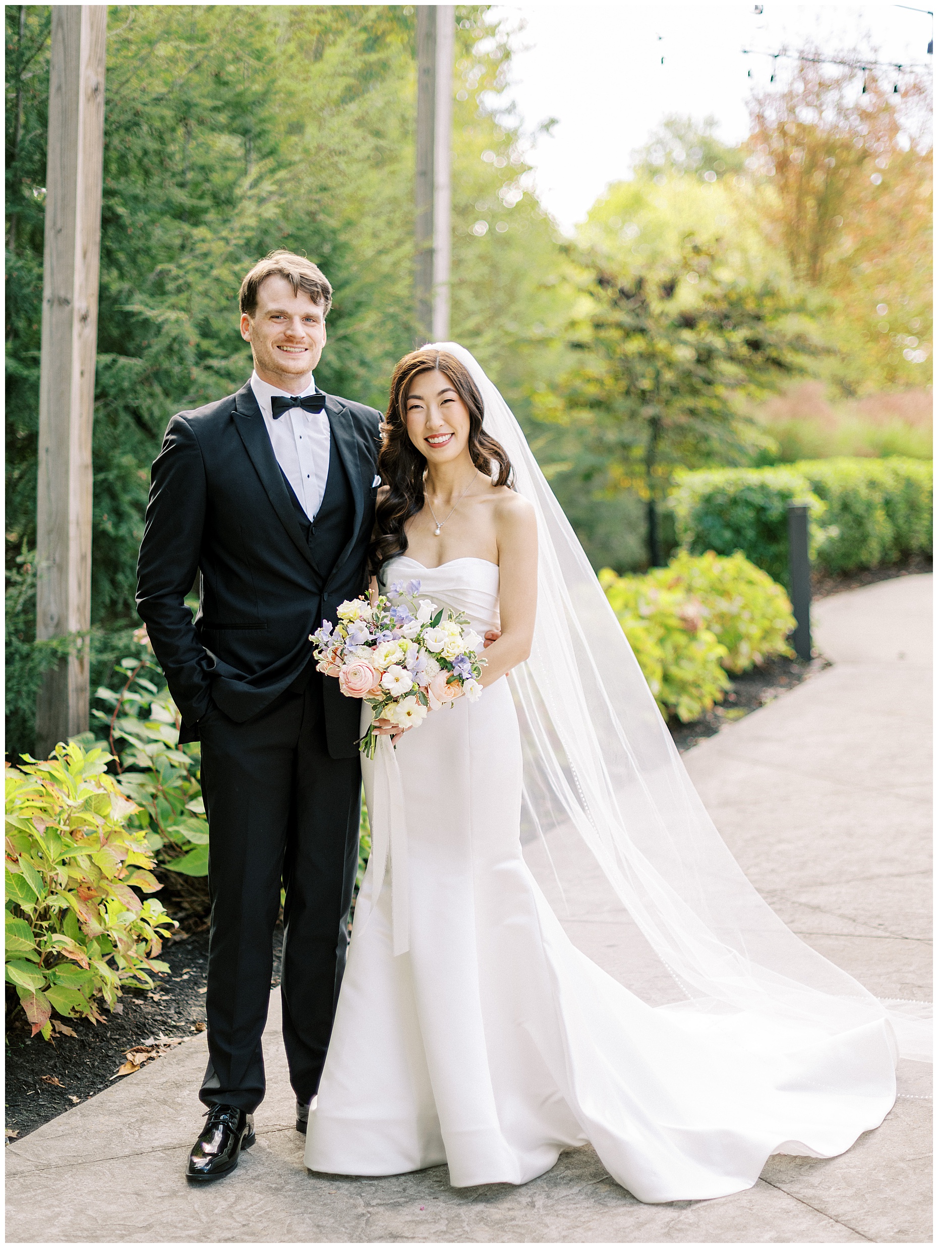 A joyful Estate at New Albany wedding featuring fall foliage, spring-inspired florals, and Esther and Peter's ceremony and reception