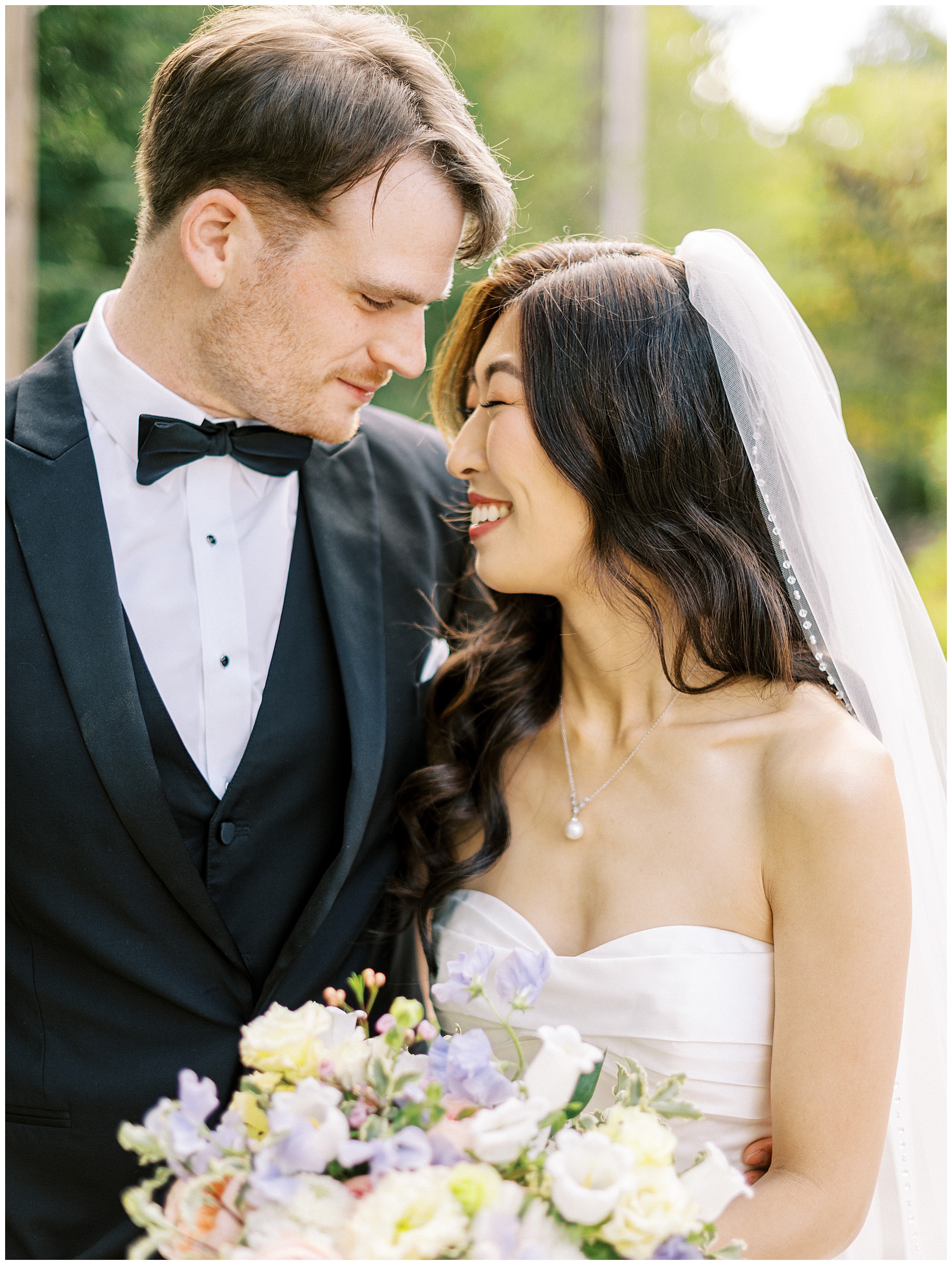 A joyful Estate at New Albany wedding featuring fall foliage, spring-inspired florals, and Esther and Peter's ceremony and reception