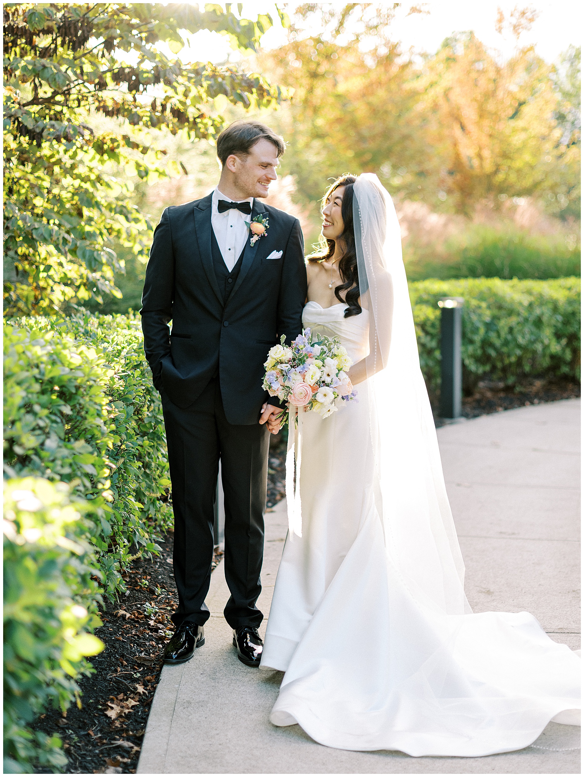A joyful Estate at New Albany wedding featuring fall foliage, spring-inspired florals, and Esther and Peter's ceremony and reception