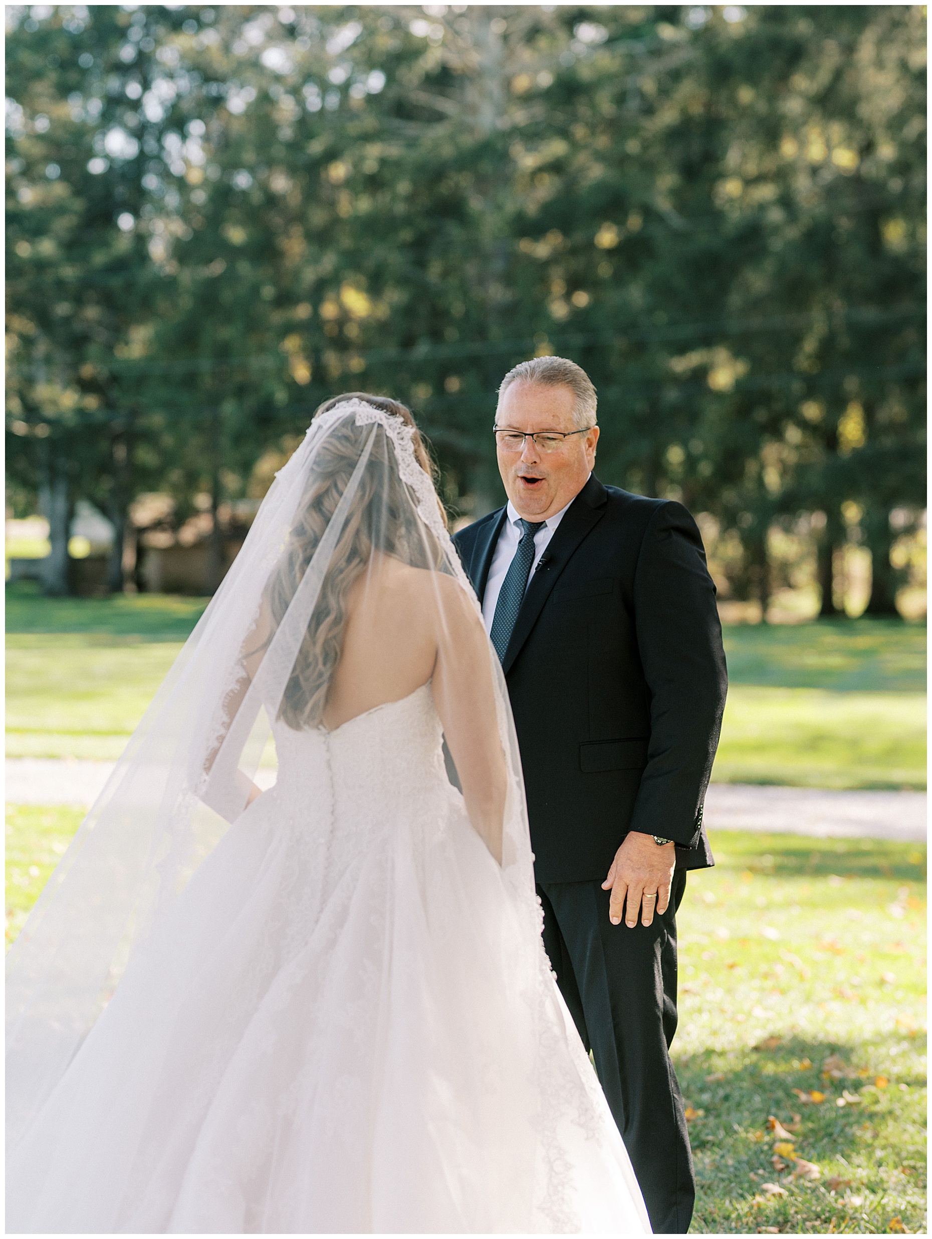 A heartfelt Cliffside Acres wedding featuring fall foliage, classic black and white details, and Lindsey and Sam's ceremony and reception