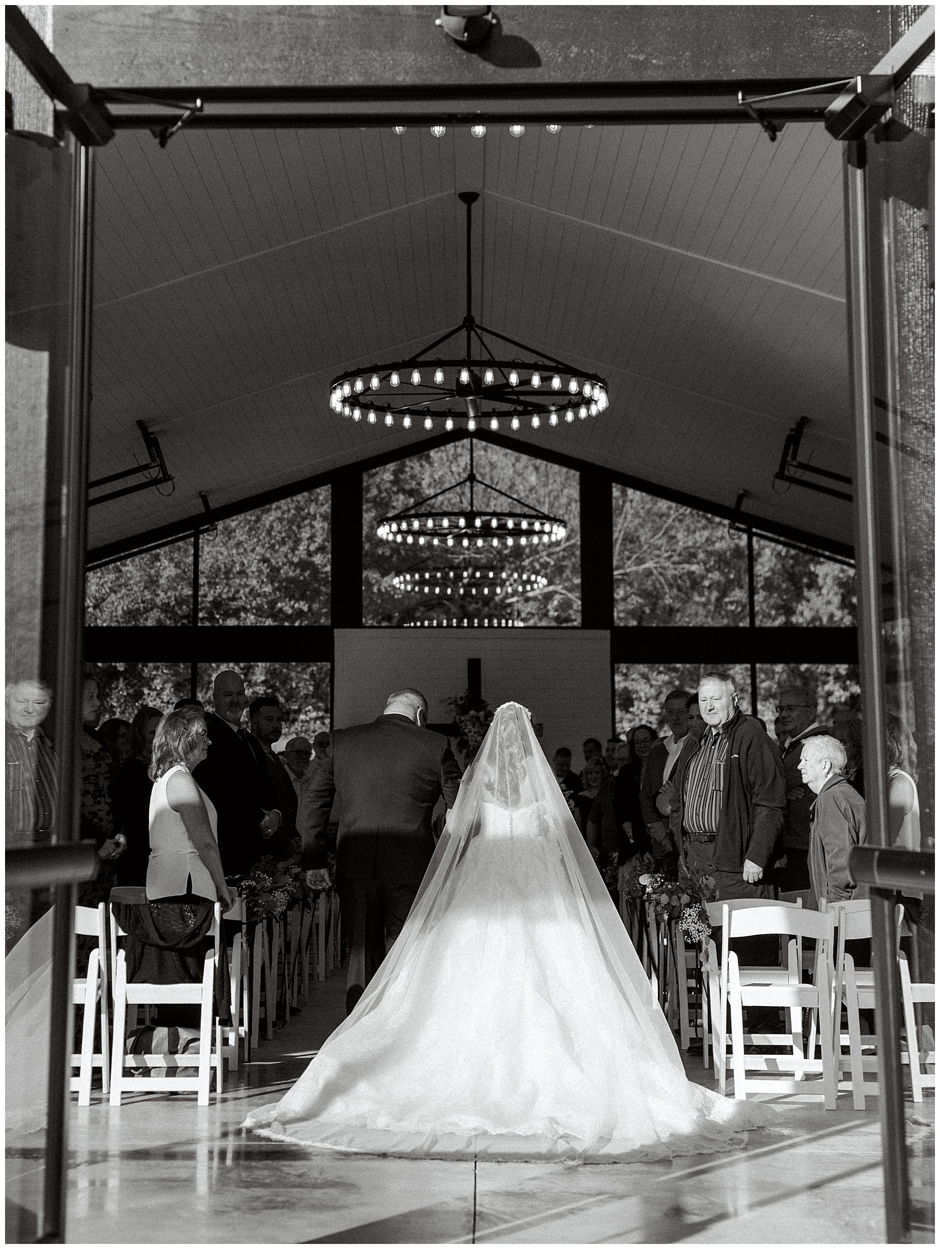 A heartfelt Cliffside Acres wedding featuring fall foliage, classic black and white details, and Lindsey and Sam's ceremony and reception