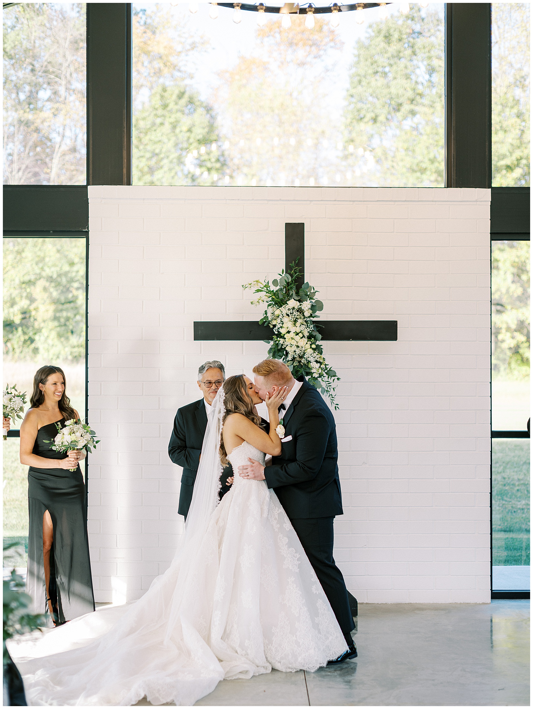 A heartfelt Cliffside Acres wedding featuring fall foliage, classic black and white details, and Lindsey and Sam's ceremony and reception