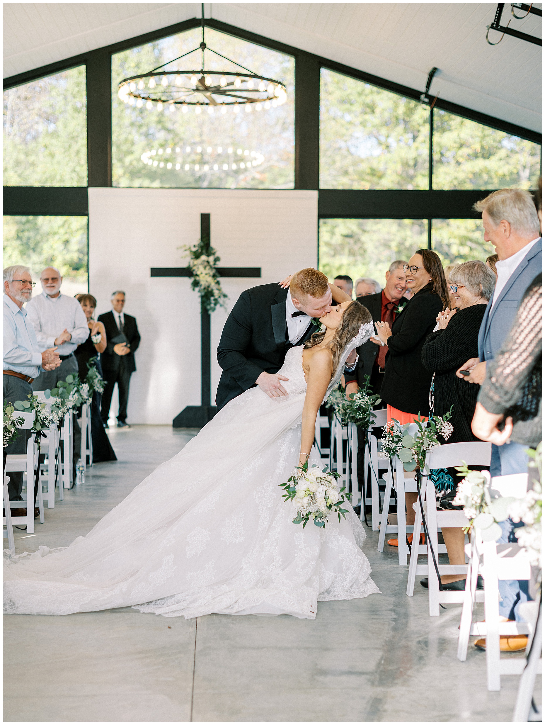 A heartfelt Cliffside Acres wedding featuring fall foliage, classic black and white details, and Lindsey and Sam's ceremony and reception