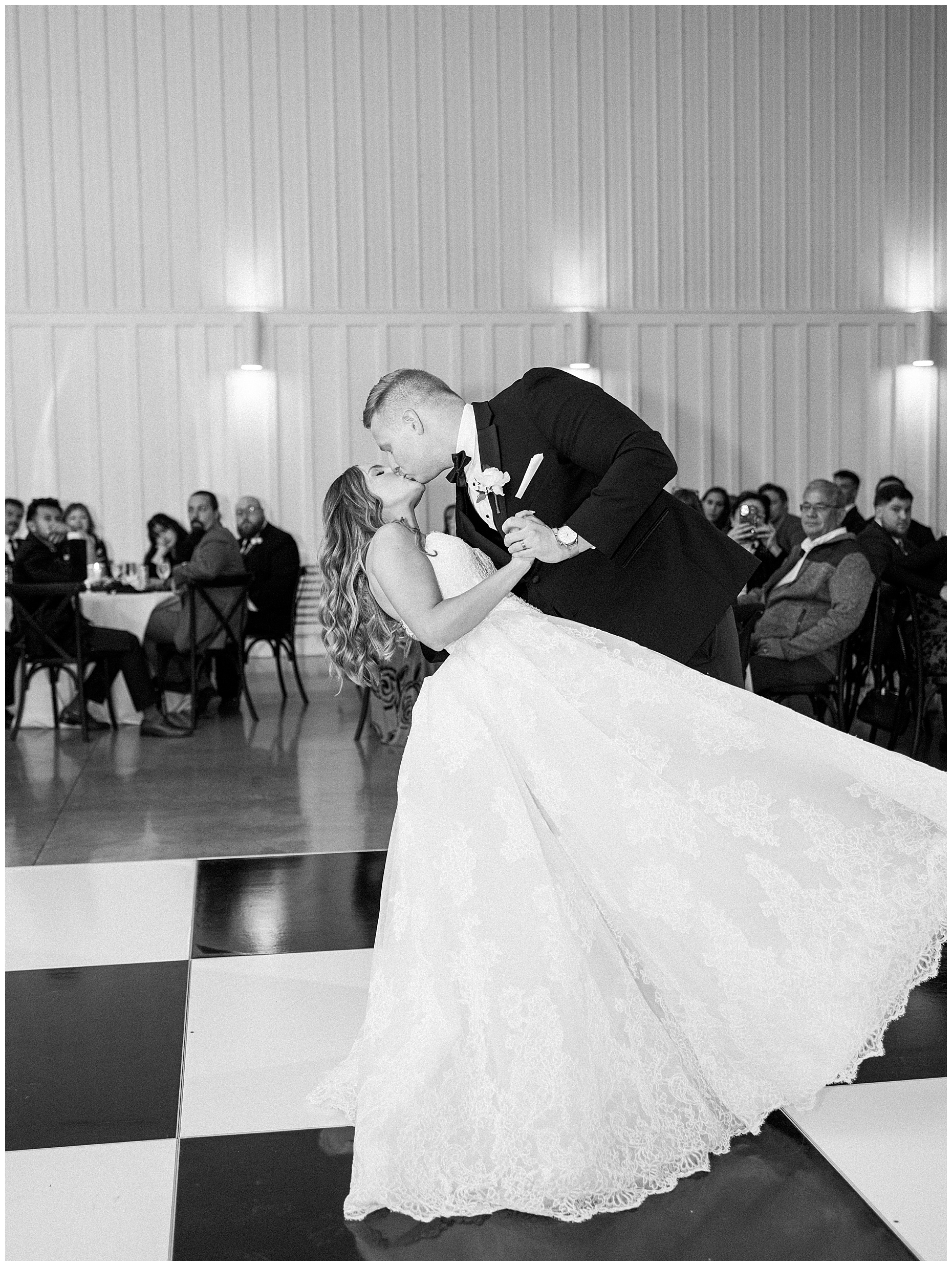 A heartfelt Cliffside Acres wedding featuring fall foliage, classic black and white details, and Lindsey and Sam's ceremony and reception